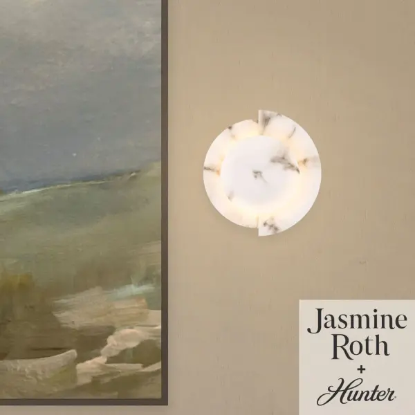 Refresh your space with the Opaline Crest Jasmine Roth LED 8 Inch Sconce, a modern fixture defined by clean lines and a naturally inspired aesthetic. Indoor-damp rated, it is ideal for bathrooms, laundry rooms, and other humidity-prone spaces. This light can be mounted up or down for versatile styling. Designed to coordinate with the Jasmine Roth lighting collection, this sconce is backed by Hunter's trusted one-year limited warranty. Rated for indoor spaces exposed to humidity. Integrated LED light included. Mounts Up or Down Clean lines, minimal, natural. INDOOR-DAMP RATED: For use in indoor spaces exposed to humidity like bathrooms and laundry rooms. MODERN: The clean lines of the modern style uses a monochromatic color palette the inspires with clean lines, minimalism, natural materials, and natural light. COORDINATING COLLECTION: Works with Jasmine Roth Lighting collection. WARRANTY: One-year limited warranty backed by the trusted experts at Hunter. - alternate view