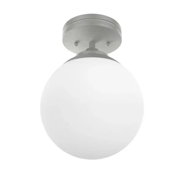 The Hepburn flush mount brings 1920s glamour to modern spaces with its cased white glass shade inspired by vintage theater lighting. Compact at 8 inches wide, it's perfect for hallways, bedrooms, and smaller rooms needing ambient light.