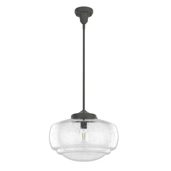 The Saddle Creek pendant reimagines the iconic American schoolhouse light with seeded glass detailing and dual-function mounting. Its 16-inch diameter makes it perfect for kitchen islands and dining spaces, while the Noble Bronze finish adds warmth.