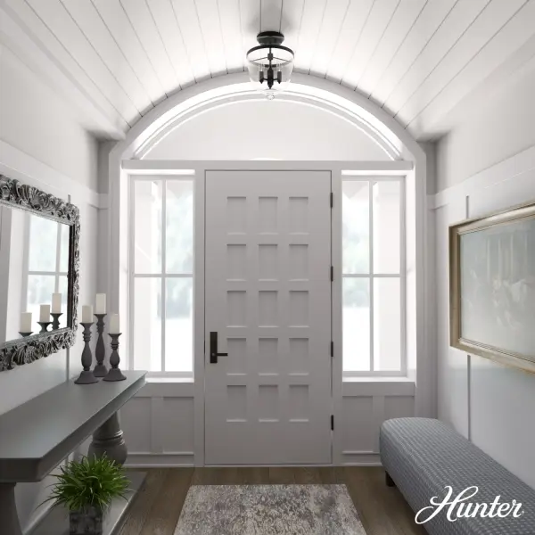 The Belltown brings traditional charm with its bell-shaped clear glass shades and natural black iron finish. Its compact 13-inch width makes it ideal for smaller spaces that need character without overwhelming the room. - alternate view