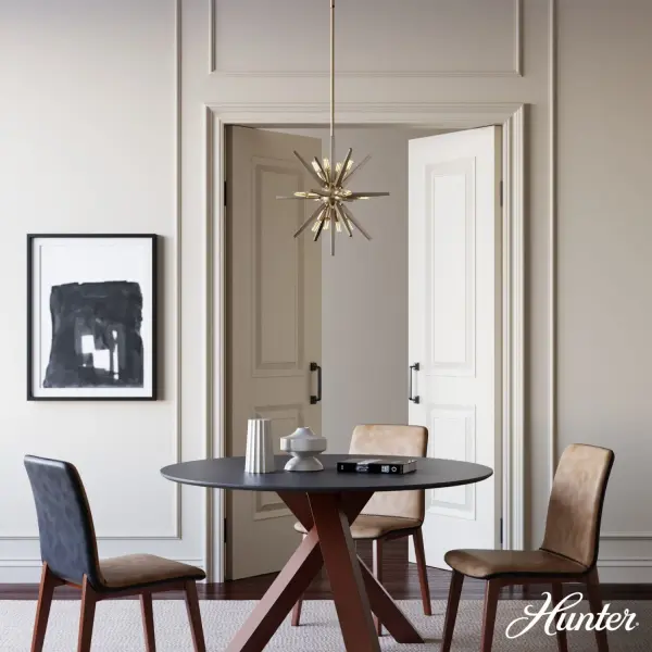The Jupiter Star pendant delivers dramatic visual impact with its 12-light starburst design in warm Alturas Gold. The wood-inspired metal construction creates an authentic mid-century aesthetic that serves as an instant focal point. - alternate view