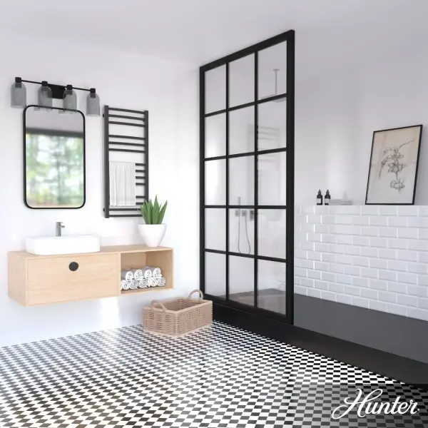 The Lochemeade brings effortless modern style to bathroom spaces with its clean lines and smoked glass dome shades. The natural black iron finish adds industrial character while maintaining a minimalist aesthetic that works across design schemes. - alternate view