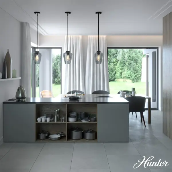 The Vidria mini pendant delivers sophisticated simplicity with its vase-shaped smoked glass shade and matte black finish. Perfect for creating intimate lighting zones over kitchen islands or dining nooks. - alternate view