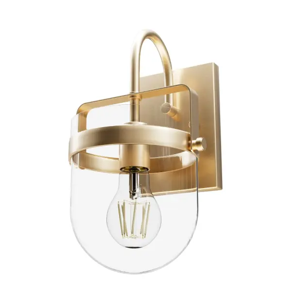 The Karloff sconce combines a classic bell-shaped clear glass shade with a textured rust metal frame, creating a versatile fixture that bridges traditional and industrial aesthetics. Compact at 7.5" wide, it's ideal for bathrooms and hallways.