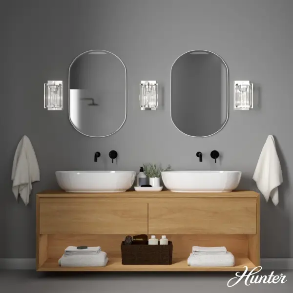 Evoking subtle art deco detailing, the Astwood wall sconce offers an effortless and modern way to update your space. Simple and stunning, it's also engineered for use in indoor spaces exposed to humidity like bathrooms. It's a welcome addition to our popular Astwood lighting and fan collections. mix and match with other fixtures from this collection or from our ceiling fan designs. Rated for indoor spaces exposed to humidity Requires 1 E26 bulbs. Bulbs not included. Down Mount Only INDOOR-DAMP RATED: For use in indoor spaces exposed to humidity like bathrooms and laundry rooms. BULB RECOMMENDATION: Maximum 60 W per light bulb or equivalent LED bulb. Bulbs not included. PICTURED HERE: Match our image using ST64 Edison light bulbs. COORDINATING COLLECTION: Works with Astwood ceiling fan collection WARRANTY: One-year limited warranty backed by the trusted experts at Hunter. - alternate view