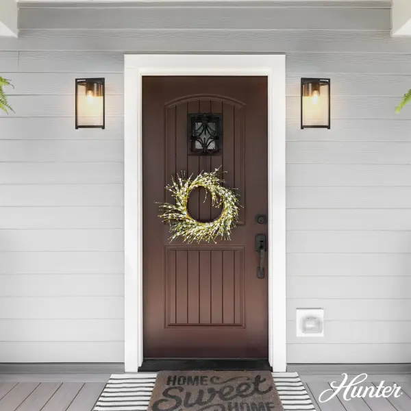 The Astwood combines modern elegance with weather-resistant durability. Its aluminum construction and WeatherMax technology ensure long-lasting performance in any climate, while the clear cylinder glass provides balanced illumination. - alternate view
