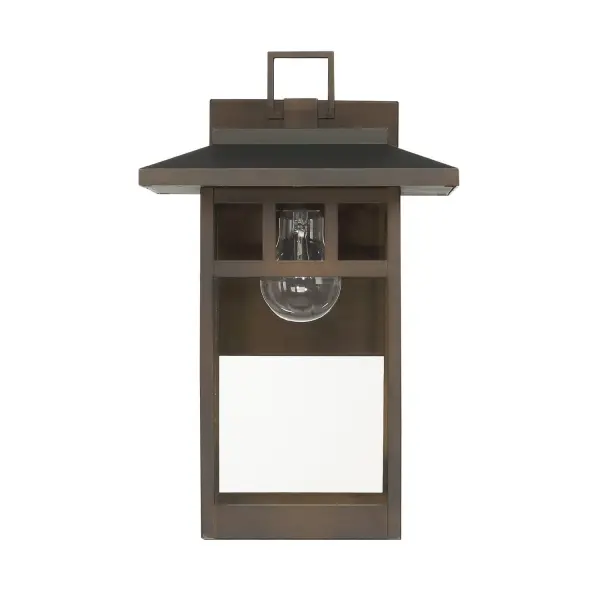The Yancy House wall light delivers timeless architectural appeal with weather-resistant construction. Its clean mission-inspired lines and matte bronze finish create a refined welcome at any entrance while aluminum and stainless steel ensure lasting performance.