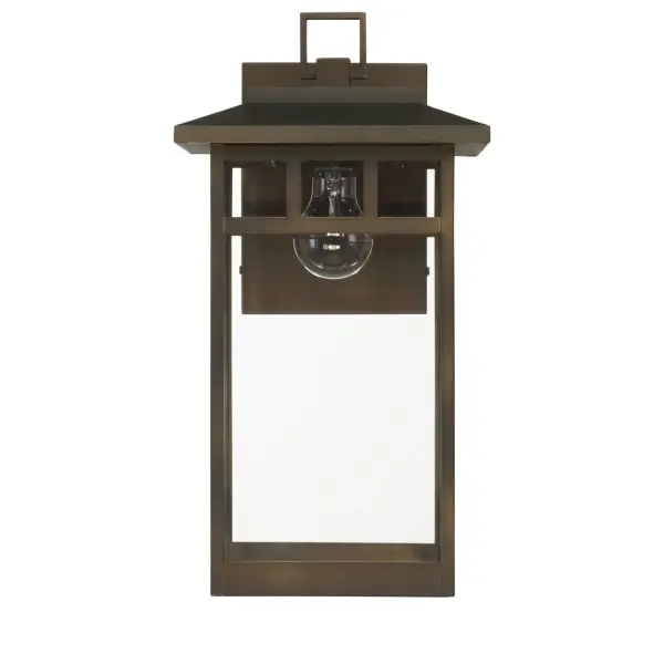 Ground your exterior in timeless design with the Yancy House Outdoor 1 Light Wall Light. At 17 inches, this large-format fixture showcases classic mission-style architecture, delivering a structured yet understated look that enhances any porch, patio, or entryway. The transitional design softens bold lines with warm, adaptable charm—perfect for modern or traditional homes. Crafted with corrosion-resistant aluminum and stainless steel, it's engineered to endure tough weather conditions while maintaining its clean finish. Compatible with a 60W bulb or equivalent LED (not included), Yancy House is where durability meets design-driven distinction. Rated for outdoor use. Down Mount Only TRANSITIONAL: Light, relaxed, elegant. Mission-inspired design with timeless lines. BUILT TO LAST: Constructed with corrosion-resistant aluminum and stainless steel for enhanced strength, durability, and performance in harsh outdoor environments. BULB RECOMMENDATION: Maximum 60W per light bulb or equivalent LED bulb. Bulbs not included. MISSION STYLE: Classic mission-style lines bring a timeless, architectural touch to your exterior spaces—balancing structure with understated style. TRANSITIONAL: The transitional style celebrates natural light and a relaxed feel with smooth, blending details that create warm yet modern spaces with the best of both worlds; elegant, minimal and adaptable. DIMENSIONS: Measures 17" tall by 7" wide, extending 10.375" from the wall—perfectly scaled for porches, patios, or entryways. WARRANTY: One-year limited warranty backed by the trusted experts at Hunter. - alternate view