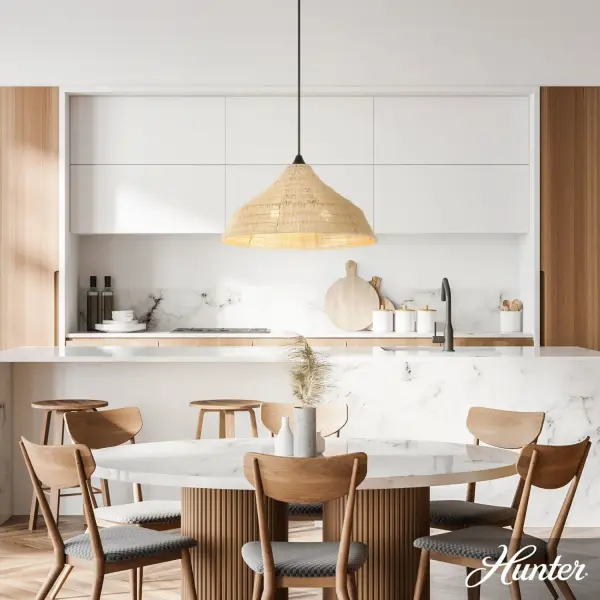 The Agoura pendant masterfully blends natural texture with clean modern lines. Its handwoven rattan shade creates beautiful light patterns while the matte black hardware adds contemporary edge. A versatile piece that works equally well in coastal, transitional, and organic modern interiors. - alternate view