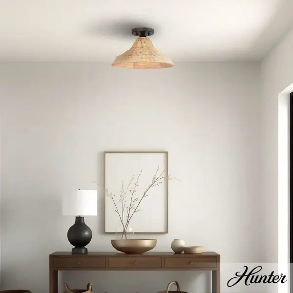The Agoura flush mount combines natural rattan texture with clean transitional design, creating a warm, inviting atmosphere. Its compact 14-inch profile and soft light diffusion make it ideal for smaller spaces seeking organic elegance. - alternate view