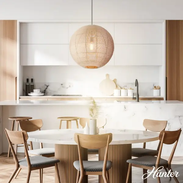 The Berkeley pendant masterfully combines natural rattan texture with refined brushed nickel hardware, creating a statement piece that bridges coastal casual and modern sophistication. Its generous 22-inch scale commands attention while the woven shade softly filters light for warm ambiance. - alternate view