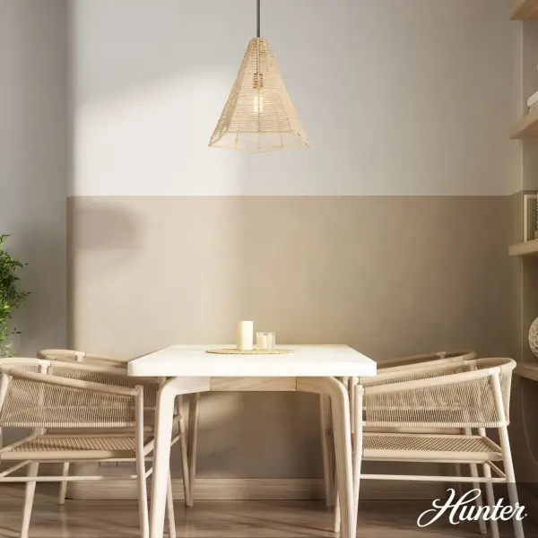 The Comet pendant brings organic texture and soft, filtered light to any space. Its handcrafted rattan shade creates an inviting glow while the matte bronze finish adds refined contrast. Ideal for adding natural warmth to contemporary or transitional interiors. - alternate view