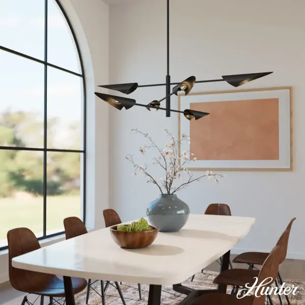 The Merian chandelier delivers modern industrial style with exceptional versatility. Its adjustable metal shades allow you to customize lighting direction for ambient or task illumination, making it perfect for large dining spaces and kitchen islands. - alternate view