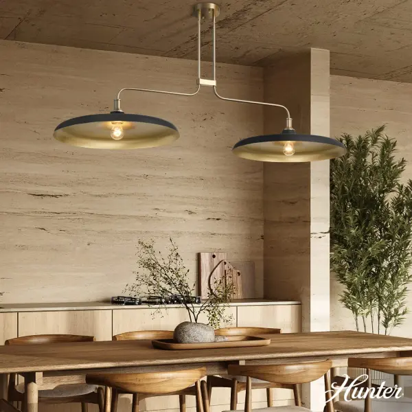 The Moriso delivers striking visual impact through its matte black exterior and warm gold interior. At 57 inches long, it's perfectly proportioned for medium to large dining tables and kitchen islands. The open frame design showcases decorative bulbs beautifully. - alternate view