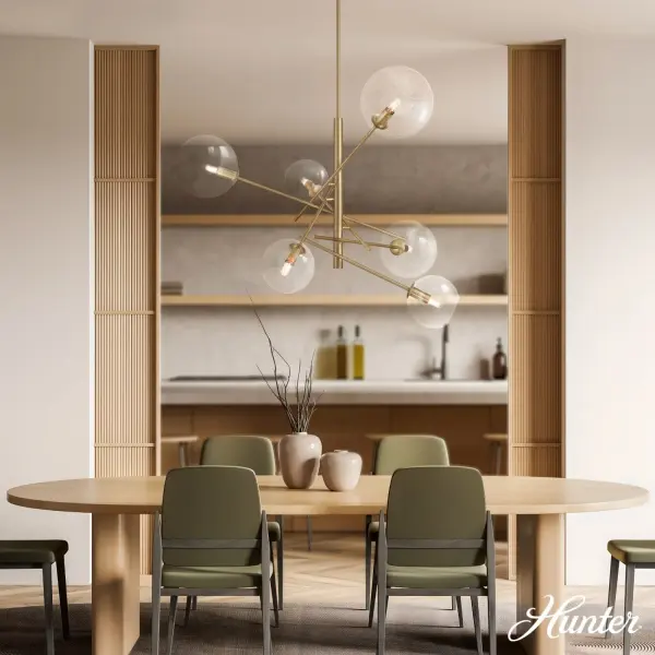 The Farling chandelier stands out with its unique adjustable arm configuration, allowing you to customize the fixture to your space. Clear glass globes in two sizes create visual interest while the Alturas Gold finish adds warmth to its contemporary design. - alternate view