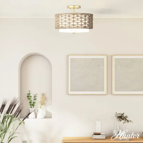 The Laila semi-flush combines natural rattan weave with cased white glass for a warm, textured look that works across design styles. Its compact 14-inch profile and damp rating make it versatile for smaller spaces and bathrooms. - alternate view