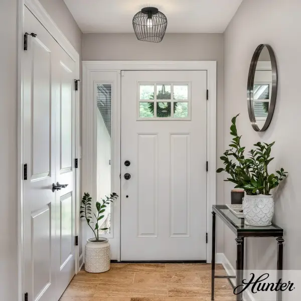 The Redding combines transitional elegance with industrial edge through its open cage design and matte black finish. Perfect for covered outdoor areas and transitional interiors, it showcases the bulb beautifully while adding weathered character. - alternate view