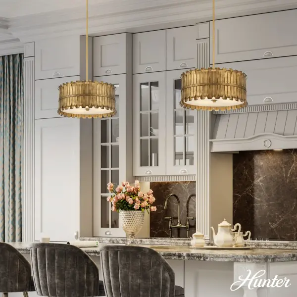 The Valdaz pendant combines contemporary minimalism with warm metallic elegance. Its brushed gold finish and frosted glass shades create soft, ambient lighting perfect for modern dining and work spaces. - alternate view