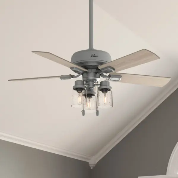 The Hartland indoor ceiling fan's clear seeded glass and included Edison LED light bulbs create a stunning look in small, casual rooms. The Noble Bronze and Matte Silver finishes complement other fixtures in a farmhouse, and casual spaces while the Indigo Blue finish adds a subtle pop of color. Create a cohesive look in your space by pairing the Hartland ceiling fan with the coordinating light fixtures in its collection. Built with our SureSpeed® Guarantee to deliver faster airflow you can feel WhisperWind® whisper-quiet motor. Rated for indoor use only 3 bulbs included AIRFLOW YOU FEEL: Built with our SureSpeed® Guarantee to deliver over 33% higher air velocity than leading competitors* while maintaining quiet, wobble-free performance. WHISPER-QUIET MOTOR: 3-speed, WhisperWind® reversible motor for optimal performance in summer and winter. INDOOR FANS: Great for bedrooms, offices and great rooms. Make sure you get the right size for the best cooling efficiency. LIGHT OUTPUT: Provides ambient, warm light. SMALL ROOM FAN: Ideal size for home offices, laundry rooms, and bedrooms. STANDARD PROFILE MOUNTING: 3 inch downrod included. COORDINATING COLLECTION: Works with Hartland lighting collection 140 YEARS OF QUALITY: Cutting-edge technology, American engineered, and ETL/UL tested for the highest safety standards — All backed by a limited lifetime motor warranty for peace of mind. COMPATIBLE ACCESSORIES: Works with Hunter and Casablanca accessories, not including Hunter Original® accessories WARRANTY: Limited Lifetime Motor Warranty backed by the only company with over 140 years in the fan business. *Based on testing conducted January 2023 comparing the average high-speed airflow velocity of Hunter SureSpeed ceiling fans and the best-selling online models for leading competitors. - alternate view