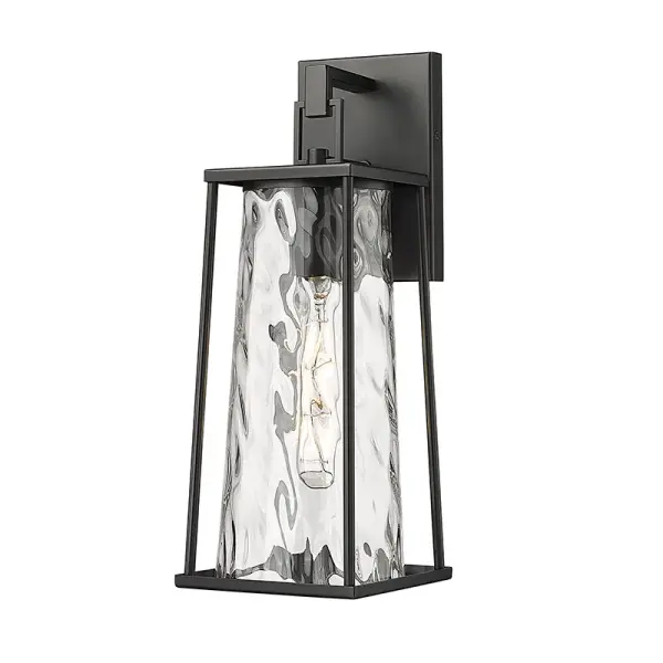 This outdoor wall sconce features a powder coated black finish designed for durability and weather resistance. Its contemporary styling complements modern exteriors while providing reliable outdoor illumination.