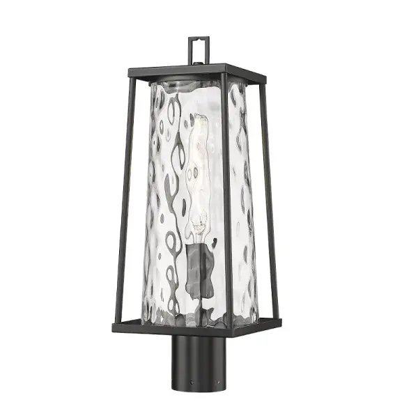 This outdoor wall sconce features a powder coated black finish designed for weather resistance and contemporary appeal. Ideal for illuminating exterior spaces with clean, modern styling.