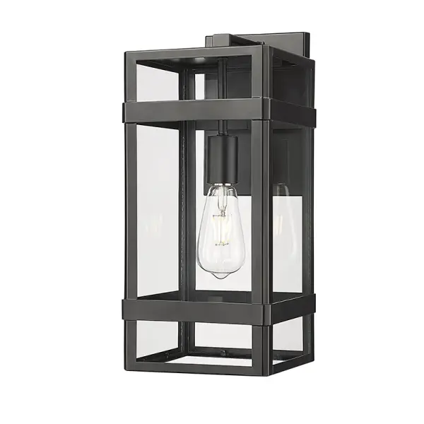 This outdoor wall sconce features a powder coated black finish designed for weather resistance and contemporary appeal. Ideal for illuminating exterior entryways, patios, and commercial facades.