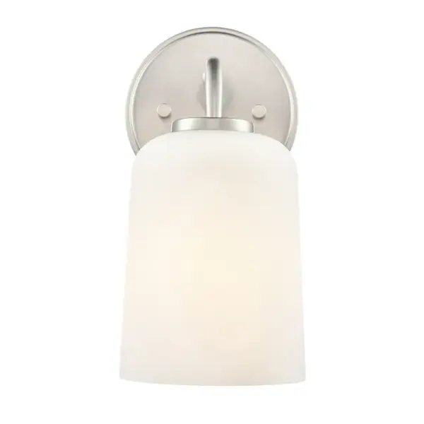 A classic wall sconce in brushed nickel finish that seamlessly blends with various design styles. Perfect for bathrooms, hallways, and bedrooms where reliable wall lighting is needed.