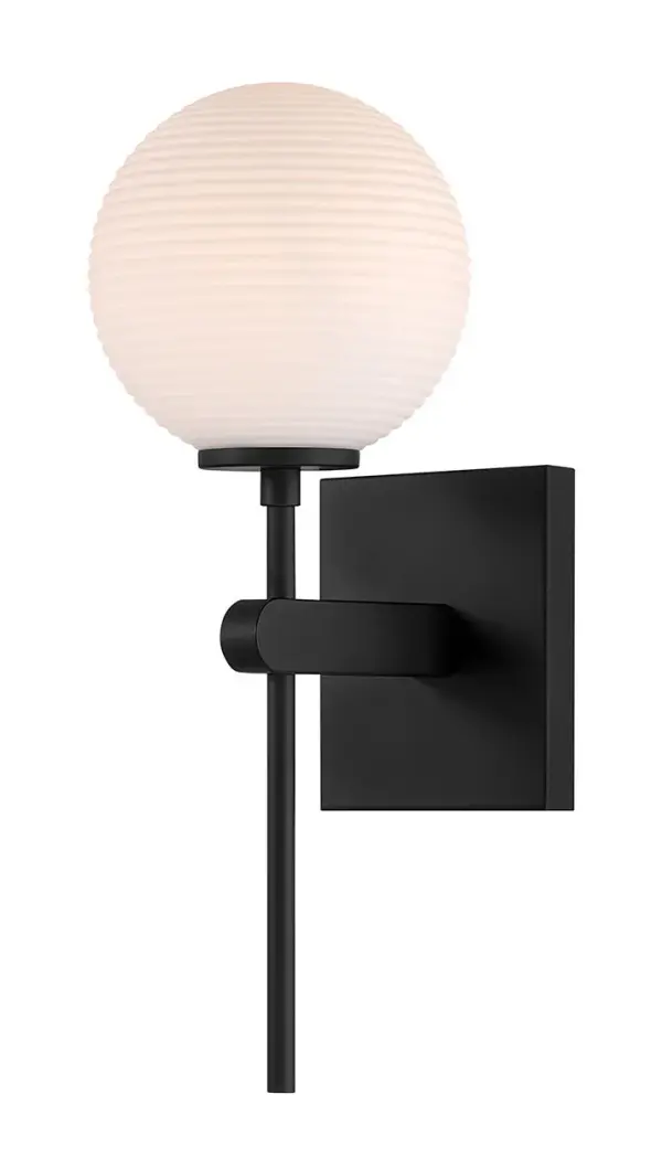 The Coretta sconce blends refined industrial simplicity with rustic warmth. A tall matte black stem supports a single etched opal globe, creating a soft, atmospheric glow that complements a wide range of modern‑industrial, contemporary, and lodge‑inspired interiors. Its damp‑rated construction make it suited for baths seeking a clean, character‑rich touch. Collection: Coretta Finish: Matte Black Glass: Etched Opal Width: 6.00" Height: 15.75" Weight: 1.50 lb Extension from Wall: 7.50" Wire: 7" Canopy: 4.75"x5.5" Number of Bulbs: 1 Maximum Wattage: 60.00 W Bulb Type: B11 Bulb Base: E12 Candelabra Light Source: Incandescent Dimmable Voltage: 120.00 V Material: Steel,Glass Country of Origin: Vietnam Safety Listing: ETL Safety Rating: Damp Connection: Hardwired Manufacturer Warranty: 1 year-limited manufacturer's warranty. Spec Sheet Instructions