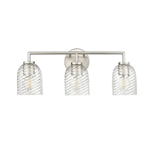 A versatile bath vanity light featuring a timeless brushed nickel finish that complements both traditional and contemporary bathroom designs. Ideal for providing functional task lighting at the mirror.