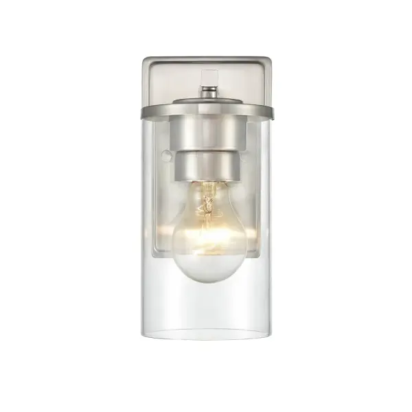 The 2701 wall sconce in brushed nickel offers a clean, transitional aesthetic that complements both contemporary and traditional interiors. Its neutral metallic finish provides versatile styling options.