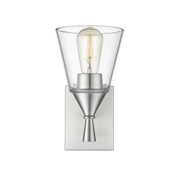 This wall sconce in brushed nickel offers timeless appeal with its neutral metallic finish. Perfect for bathrooms, hallways, and bedrooms, it provides functional lighting while complementing various design styles.