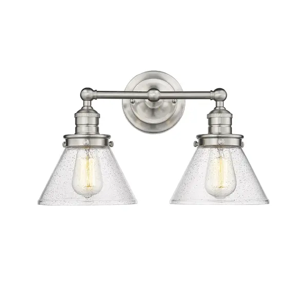 A versatile bath vanity fixture featuring a timeless brushed nickel finish that complements both traditional and contemporary bathroom designs. Ideal for providing functional task lighting at the mirror.