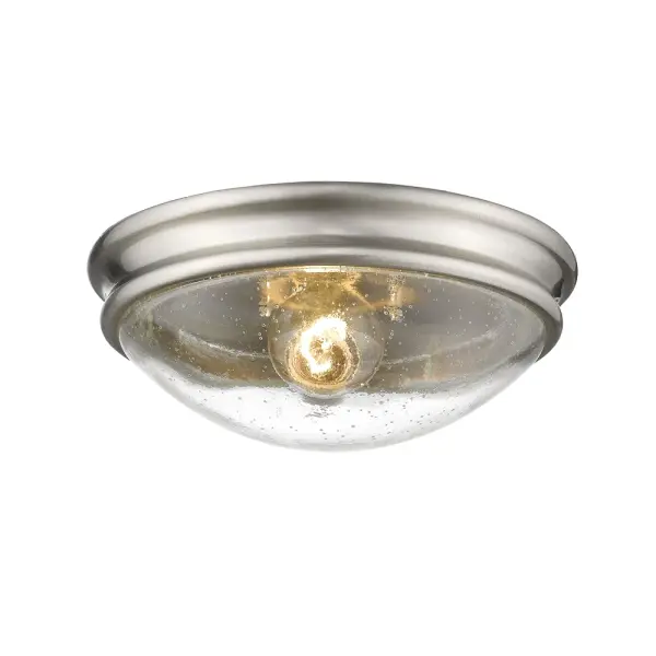 This flush mount fixture combines textured threaded glass with a refined brushed nickel finish, offering a sophisticated lighting solution for low-ceiling spaces. Perfect for transitional interiors.