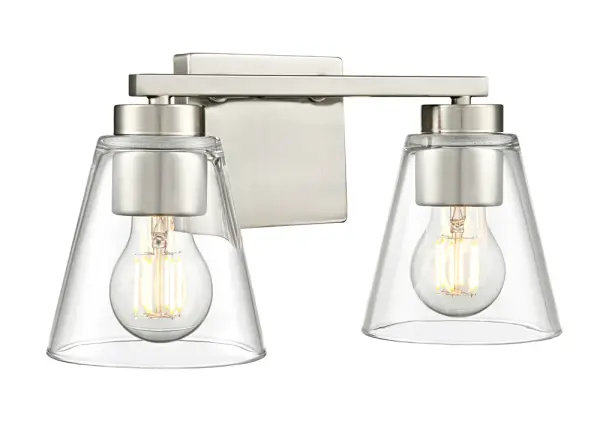 The Strayhan 2-Light Vanity combines streamlined design with flared crystal-clear glass shades, creating a sophisticated cosmopolitan aesthetic. Its brushed nickel finish and understated elegance make it versatile for various bathroom styles.