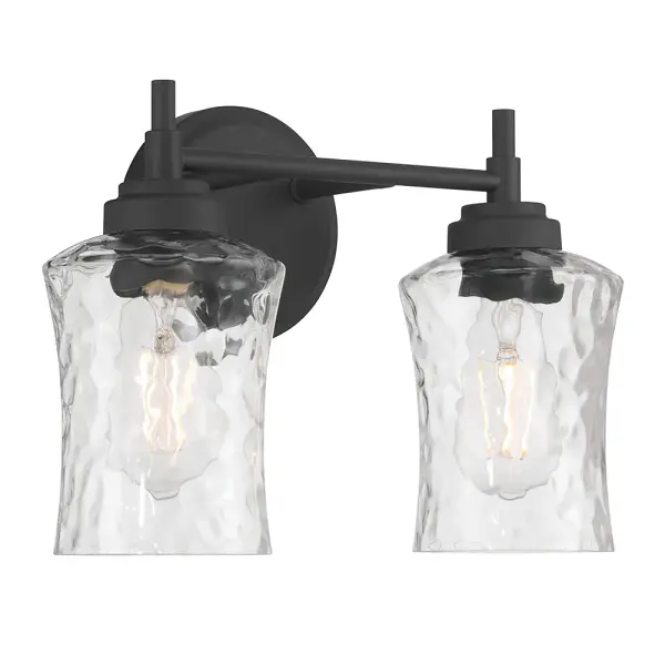 The Clarvyn vanity light combines clear water glass shades with clean contemporary lines in matte black. The stone water glass creates a beautiful dappled lighting effect, perfect for modern bathrooms seeking both style and function.