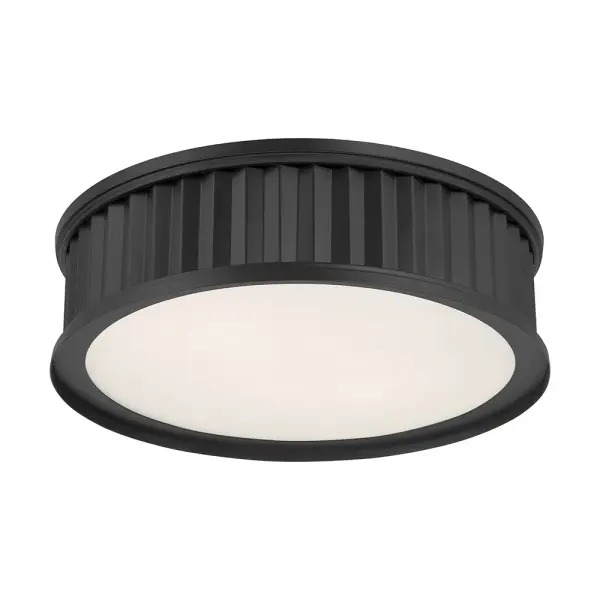 The Corvella flush mount combines striking corrugated metalwork with a matte black finish and opaque white diffuser for a perfect blend of industrial edge and gentle illumination in modern spaces.