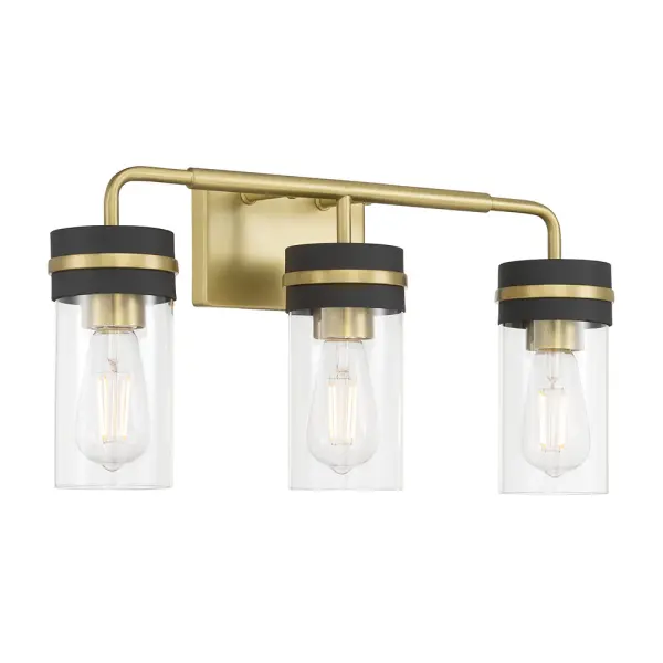 The Marbridge vanity light combines post-industrial styling with a stunning vintage brass and matte black finish. Clear glass cylinder shades showcase vintage bulbs beautifully, creating sophisticated appeal for any bathroom.