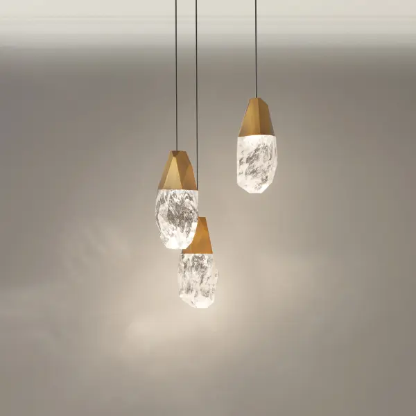 A shower of jewels. Suspended in mid-air, Schonbek Optic Crystal and Optic Haze Quartz elements composed of natural quartz gemstone illuminate at varying heights to entice. Cascading from above and perfectly designed to make a powerful yet elegant statement.