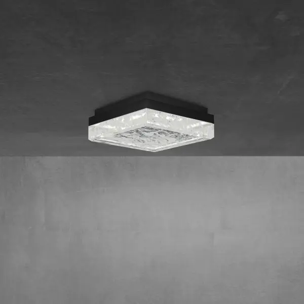 The Whisper flush mount combines natural quartz gemstone with aged brass for a sophisticated, dimensional look. Its compact 12-inch profile delivers powerful LED illumination while making an elegant architectural statement in any space.