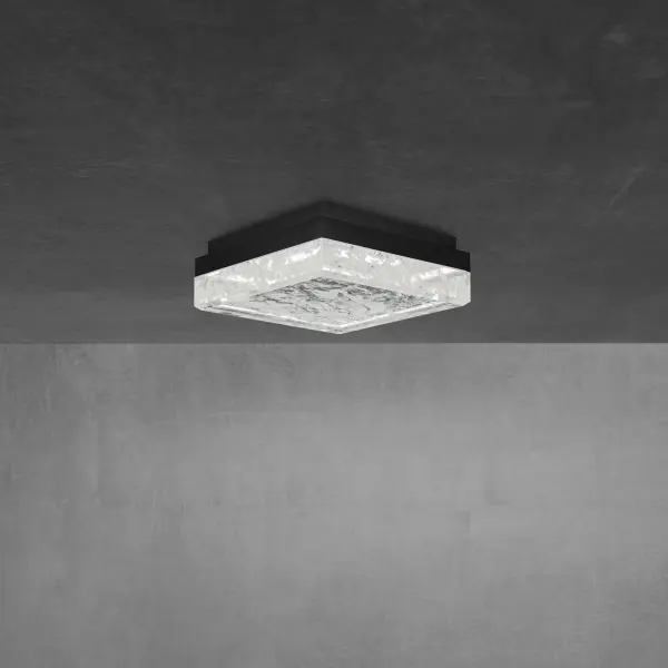 A chiseled luminaire offers a dimensional look for a luxurious aesthetic. Schonbek Optic Haze® Quartz composed of natural quartz gemstone creates an elegant centerpiece for any room to complete a powerful architectural statement.