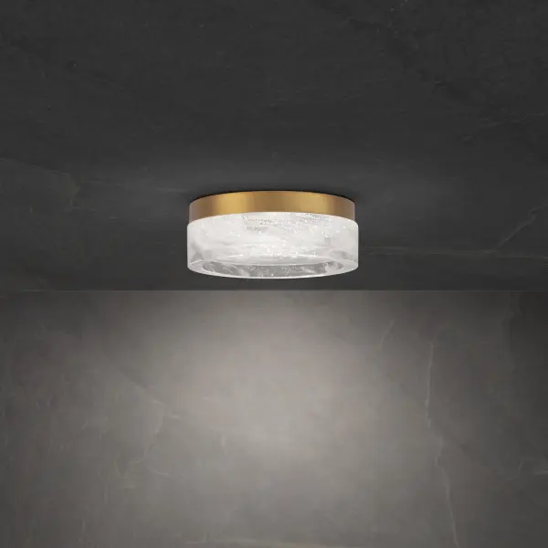 A modern round form with an artistic shade of Schonbek Optic Haze® Quartz delivers a soft, welcoming glow from premium quality LEDs. This lovely ceiling mount projects from a stepped hardware frame.
