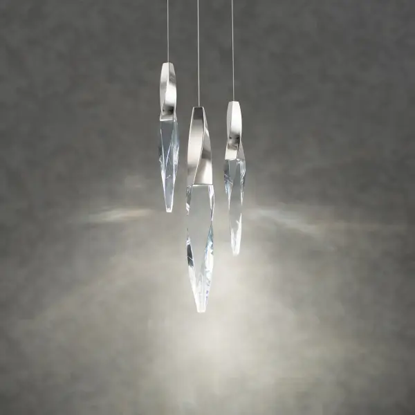 The Kindjal pendant combines luxe optic crystal icicles with integrated LED technology for a striking modern statement. Its compact 12-inch width makes it perfect for intimate spaces while delivering 1200 lumens of adjustable light.