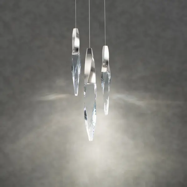 A subtle twist of luxe. Kindjal features exquisite Optic Crystal icicles that twist to a point from a cohesive metal casting, concealing a powerful LED that provide ample illumination. Stylish, textured materiality.