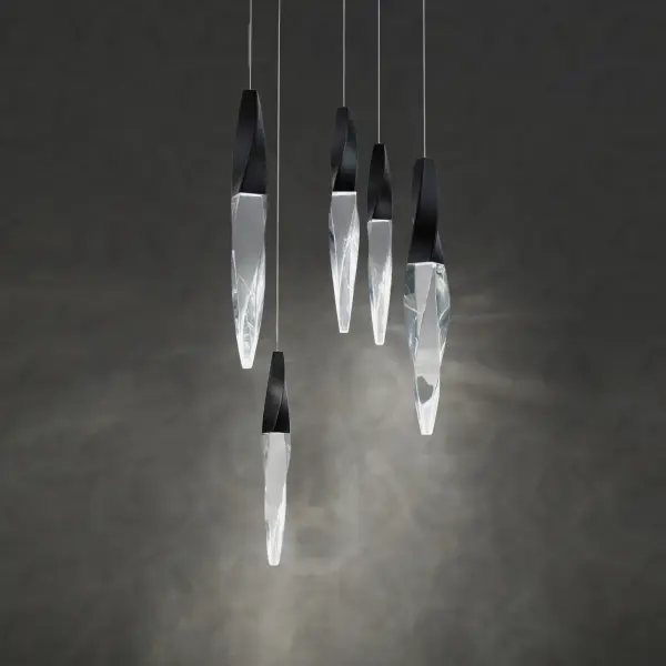 A subtle twist of luxe. Kindjal features exquisite Optic Crystal icicles that twist to a point from a cohesive metal casting, concealing a powerful LED that provide ample illumination. Stylish, textured materiality.