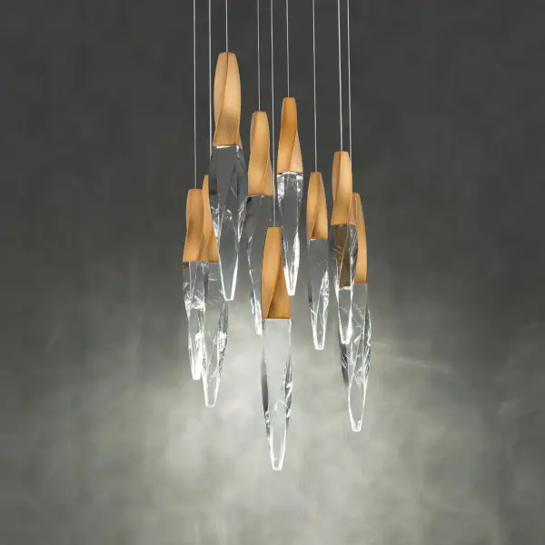 The Kindjal combines dramatic twisted crystal icicles with integrated LED technology for a luxurious statement piece. Its compact 17-inch width and powerful 3600 delivered lumens make it versatile for various spaces.