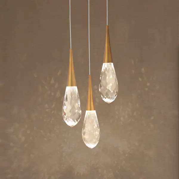 Crystal fashion comes to light in unique forms. Delicate, graceful drops of exquisite crystal embraced by tapered metal forms that glow with a charming luster. Matching crystal overlays are applied to the metal canopies for an additional touch of luxury.