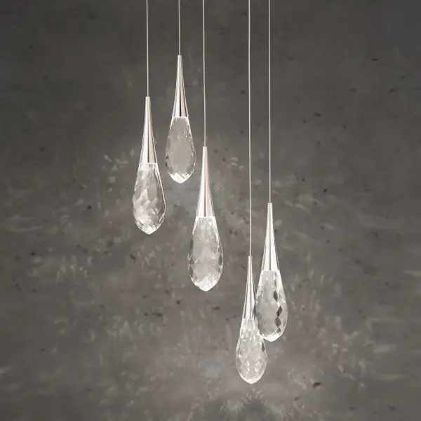 Crystal fashion comes to light in unique forms. Delicate, graceful drops of exquisite crystal embraced by tapered metal forms that glow with a charming luster. Matching crystal overlays are applied to the metal canopies for an additional touch of luxury.