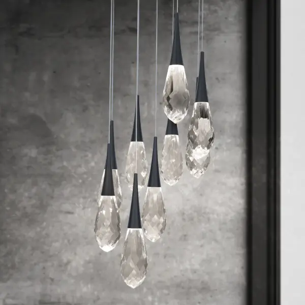 Crystal fashion comes to light in unique forms. Delicate, graceful drops of exquisite crystal embraced by tapered metal forms that glow with a charming luster. Matching crystal overlays are applied to the metal canopies for an additional touch of luxury.