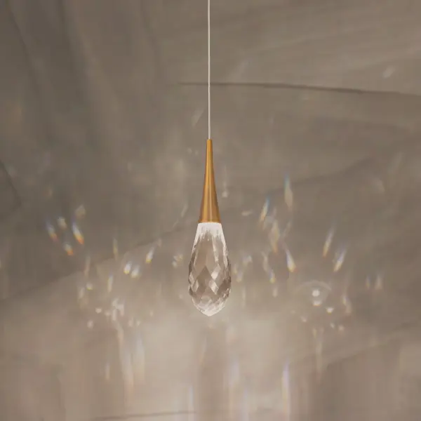 Crystal fashion comes to light in unique forms. Delicate, graceful drops of exquisite crystal embraced by tapered metal forms that glow with a charming luster. A matching crystal overlays is applied to the metal canopies for an additional touch of luxury.
