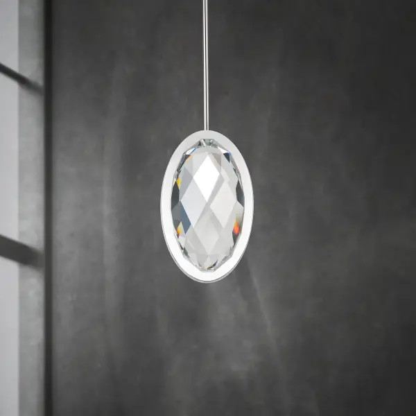 The Wonder mini pendant showcases a faceted optic crystal that's internally illuminated by hidden LED sources, creating a sophisticated focal point. Its compact 6-inch width makes it perfect for smaller spaces or grouped installations.